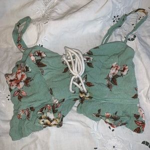 Two piece set. Flowey shorts. Tight fitting shirt with cleavage.